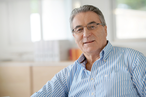 Middle-Aged Man Wearing Glasses Considering Cataract Surgery