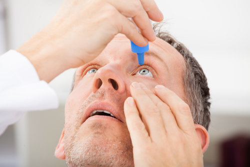 Man Using Eye Drops for Dry Eye